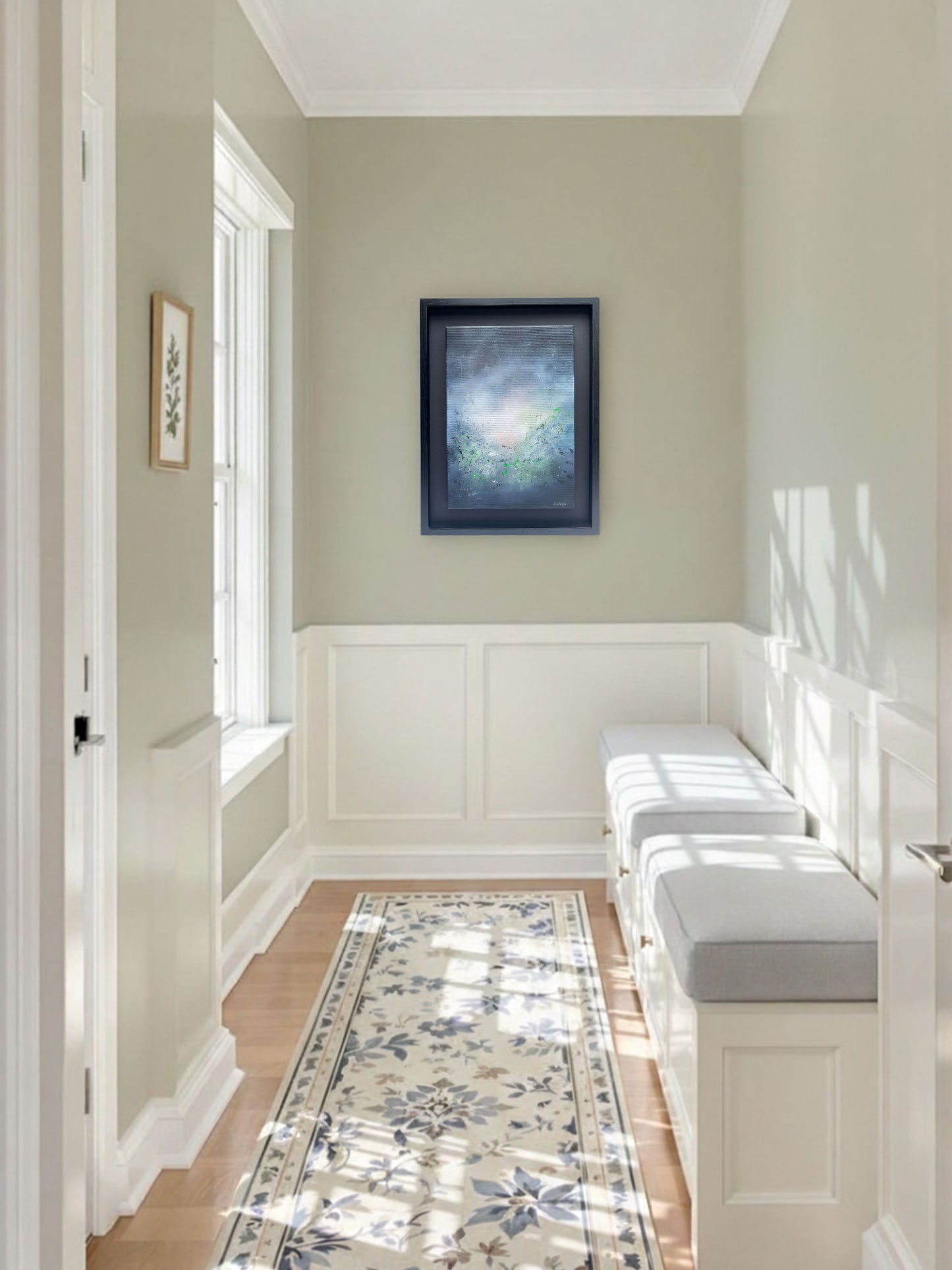 A serene, minimalist hallway with soft sage-green walls and elegant white wainscoting. On the far wall, "Mists of Truth", and abstract painting by artist SInéad Guilfoyle