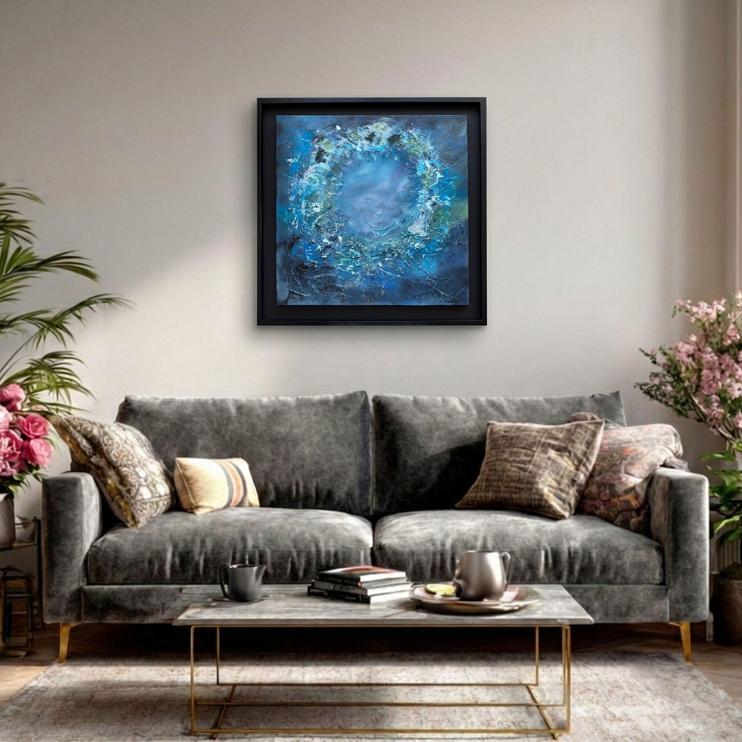 Modern neutral living room featuring Echoes Beneath abstract art by Sinéad Guilfoyle above a light grey sofa.