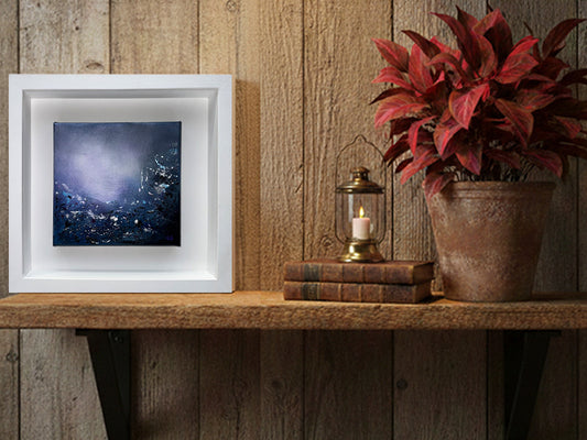 Rustic interior decor featuring 'Lavender Dawn I' abstract artwork by Sinéad Guilfoyle on a warmly lit shelf.